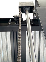 Close-up of the roller chain, sprocket and chrome hydraulic cylinder rod on the Olympic 2PTS-8800 triple stacker