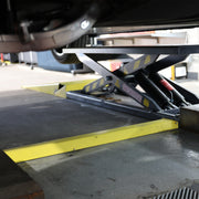 BendPak MDS-6LP 6,000-lb. mid-rise lift in a compact shop service bay