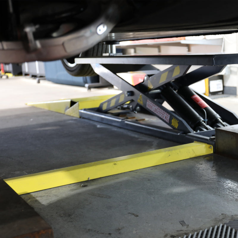BendPak MDS-6LP 6,000-lb. mid-rise lift in a compact shop service bay