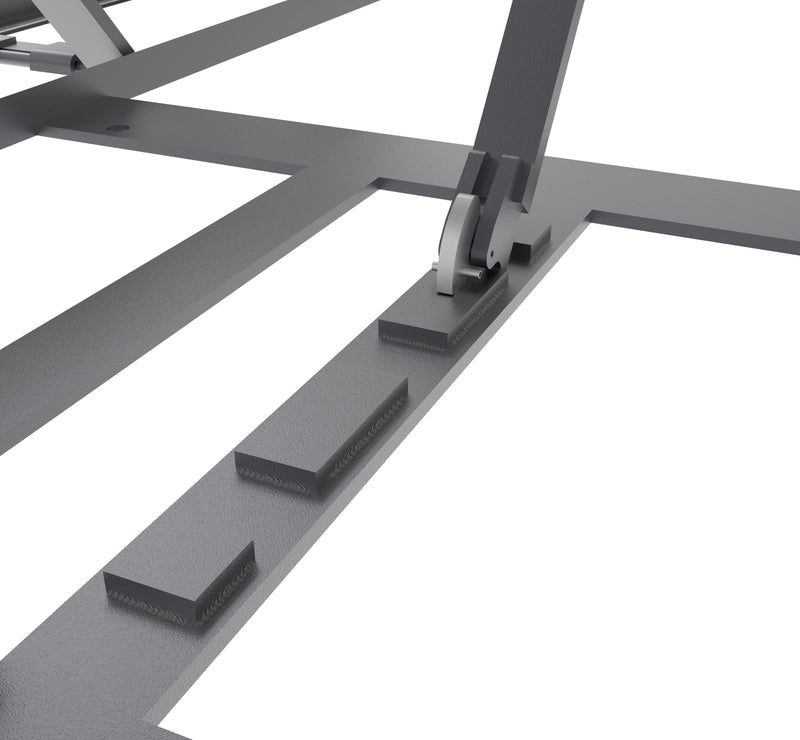 Mechanical safety lock and welded locking blocks on the base frame of a BendPak LR-60 scissor lift.