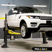 MaxJax M7K Deluxe portable two-post car lift set up for residential garage vehicle service.